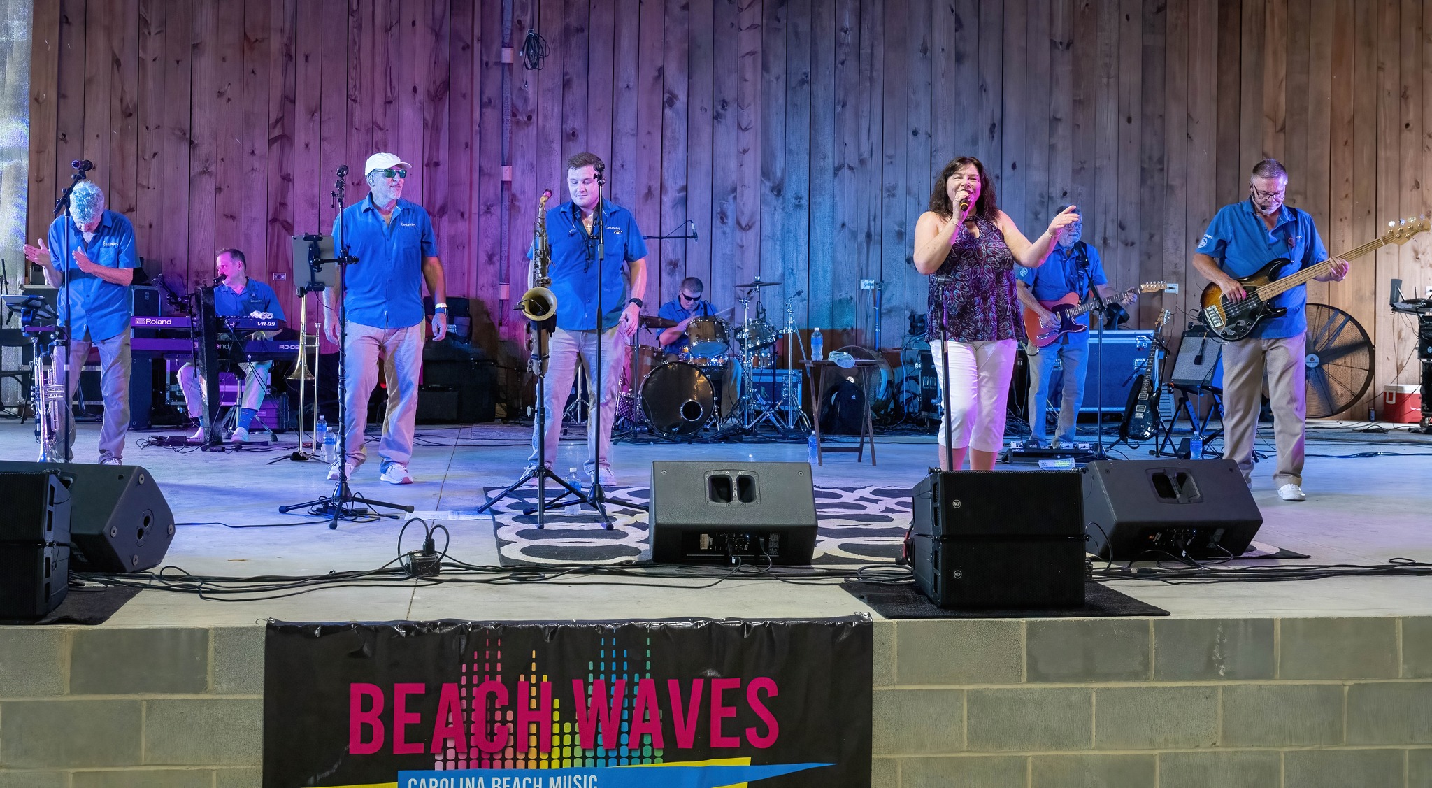 Full band performing on stage