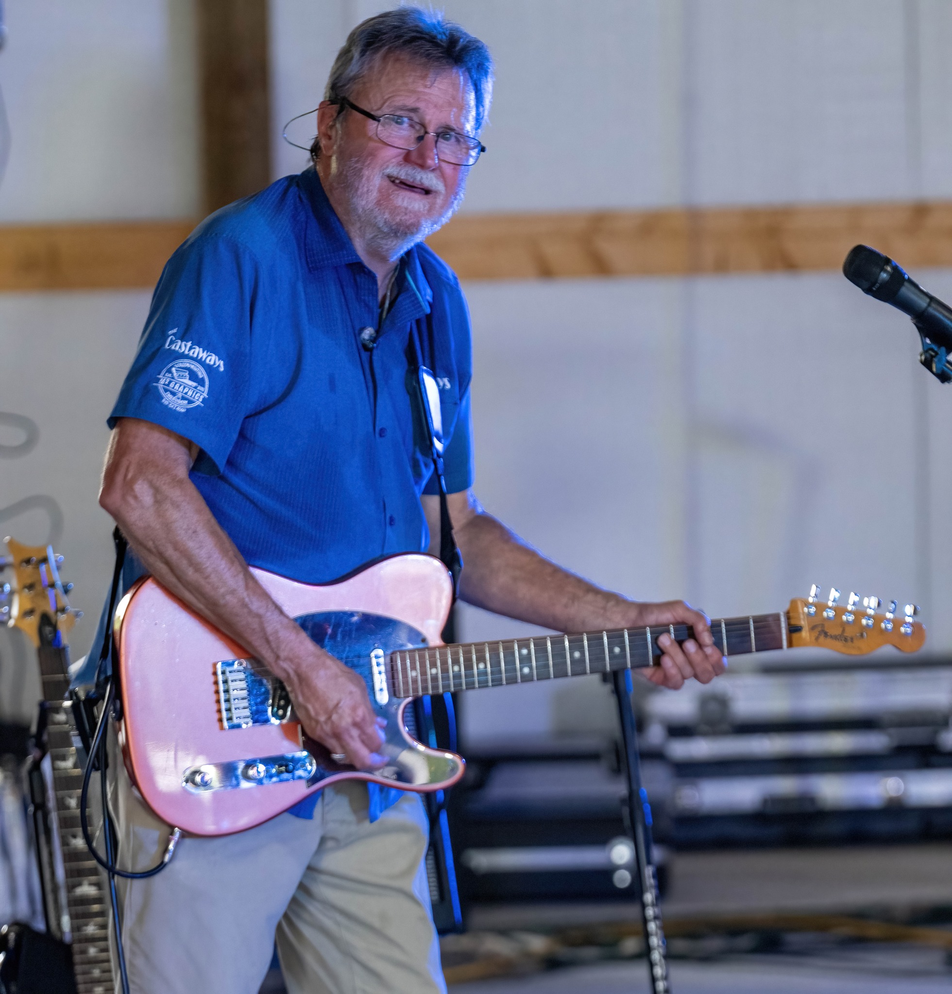 Guitarist smiling during performance